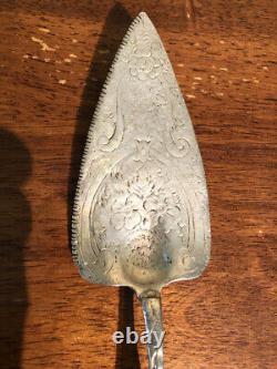 Antique solid sterling cake server. Extremely old one. Beautiful design work. 132