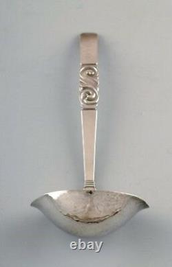 Georg Jensen. Cutlery, Scroll No. 22, Hammered Sterling Silver Sauce Spoon